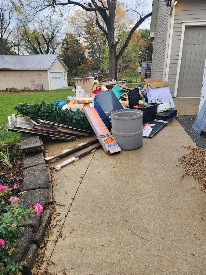 Dumpster being loaded with debris for Commercial Dumpster Rental in Rocky River